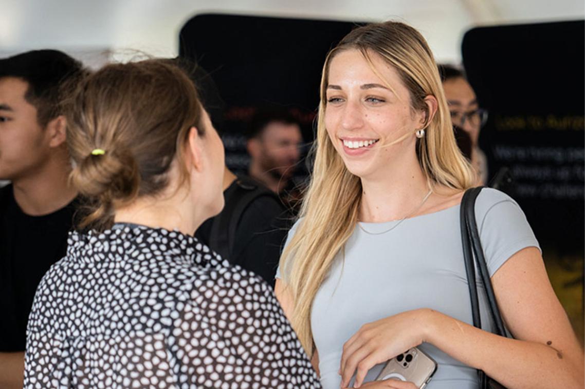 Student talking with an advisor.